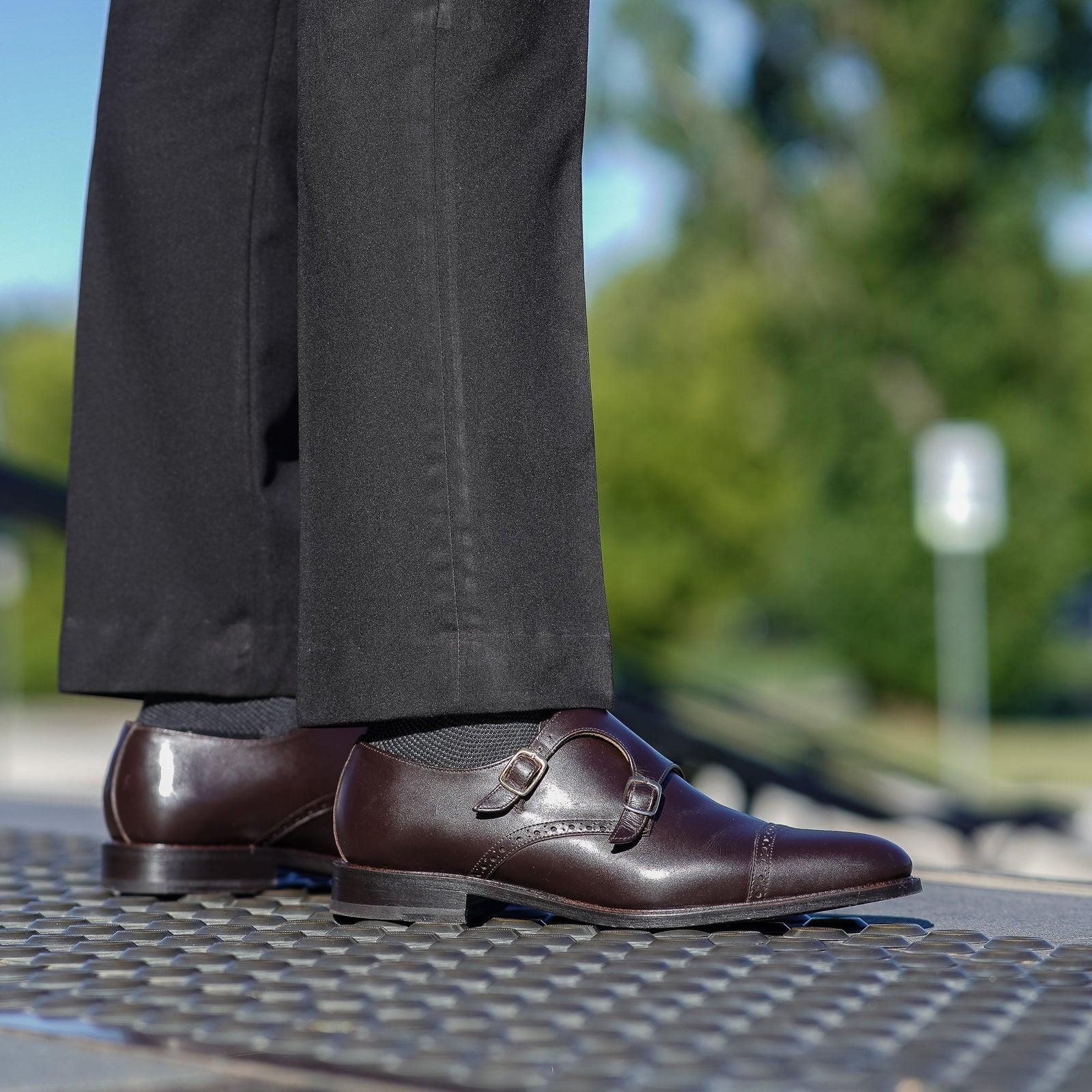 Brown double strap monk shoes paired with formal outfit for wedding