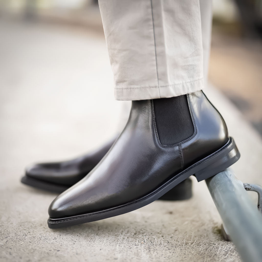 Mens black chelsea boot paired nicely with jeans, chinos, dress pants and suits for weddings, office, business events etc.