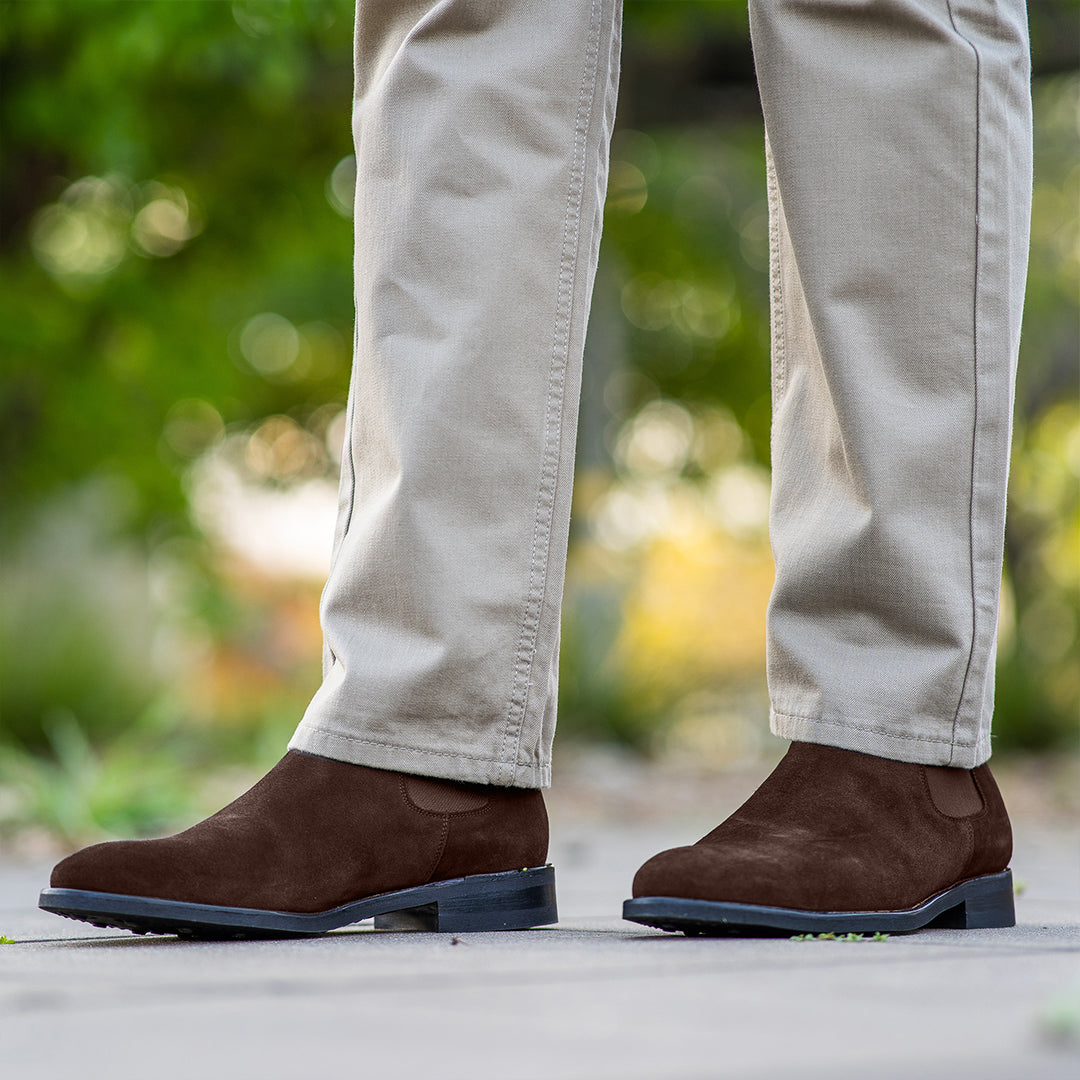 Mens brown suede chelsea boots paired with biege chinos for the office