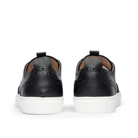 The Alpha low top brogue sneakers in black with leather pull tab