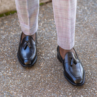 Tassel loafer in black with blake rapid stitch construction and worn casual outfit