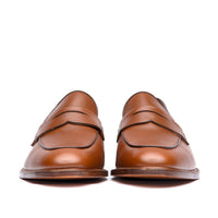 Tan penny loafers with amazing patina on the toe cap and leather vamp.