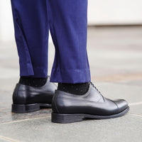 Black cap toe oxfords is the fundamental shoes for every man and nicely bespoke suits and shirts