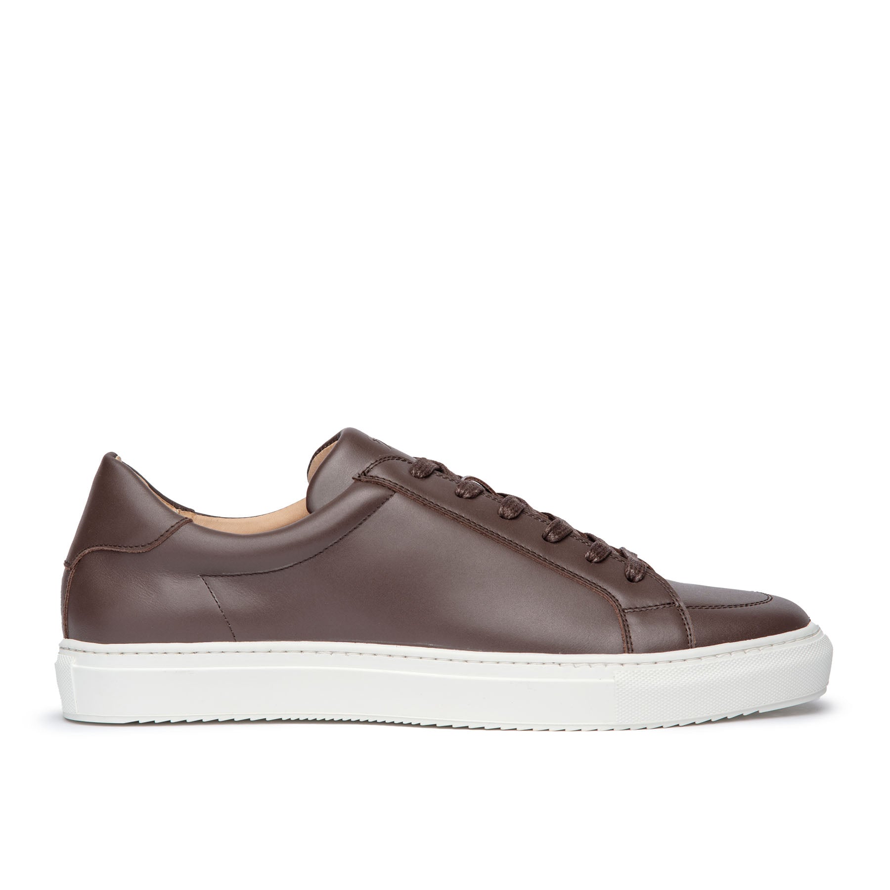 Brown leather dress sneakers featuring full grain calfskin and white rubber sole