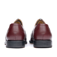 Oxblood brogue shoes with stacked leather heel and rubber injection