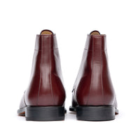 Burgundy dress boots with beautifully stacked leather heel and rubber injection for traction