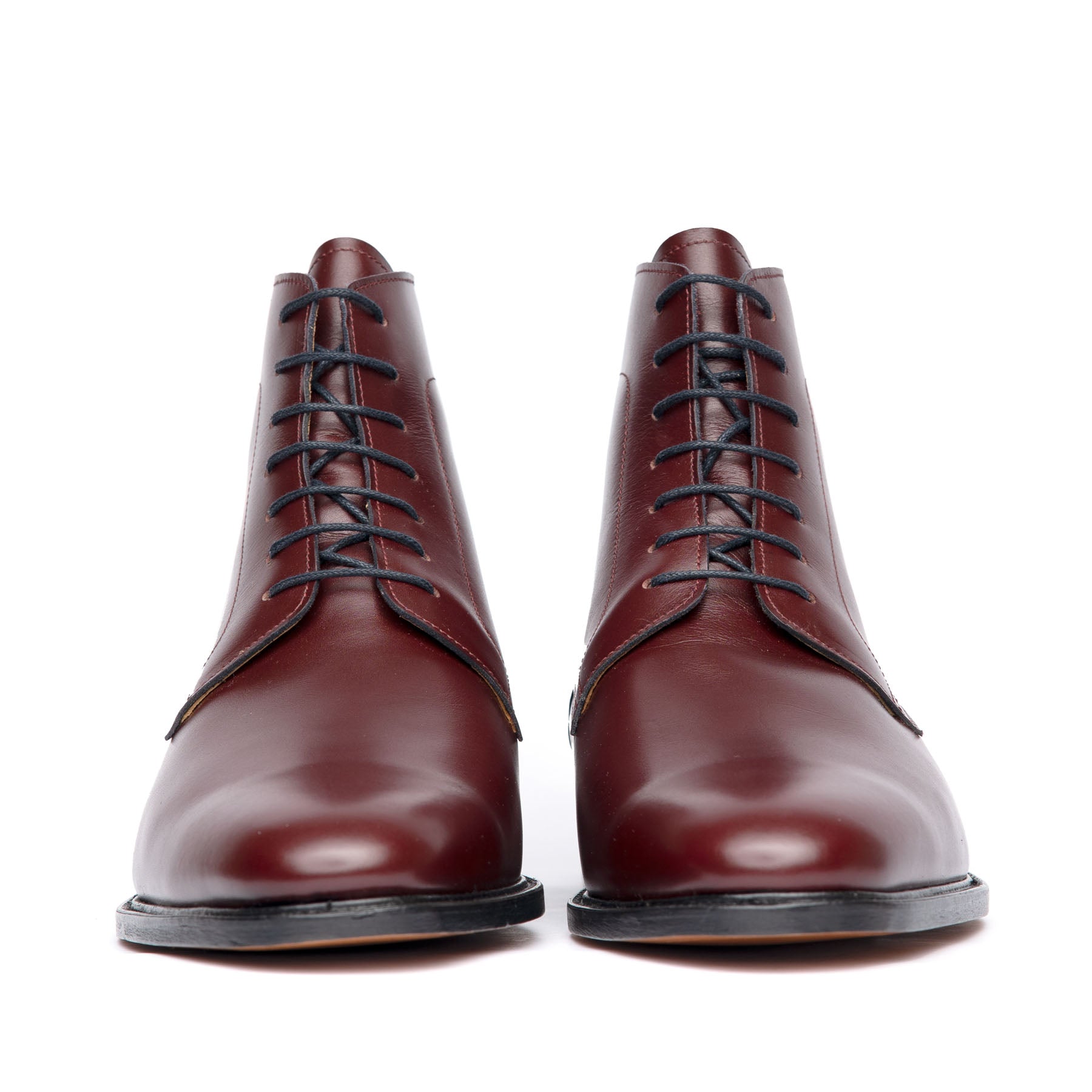 Burgundy dress boots featuring full grain leather, open lace system and patina on the toe cap