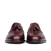 Burgundy loafer with handmade tassel at the vamp and beautiful patina at the top cap