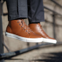 High tops sneakers for men crafted using full grain leather and styled beautifully with paired with green chinos and houndstooth
