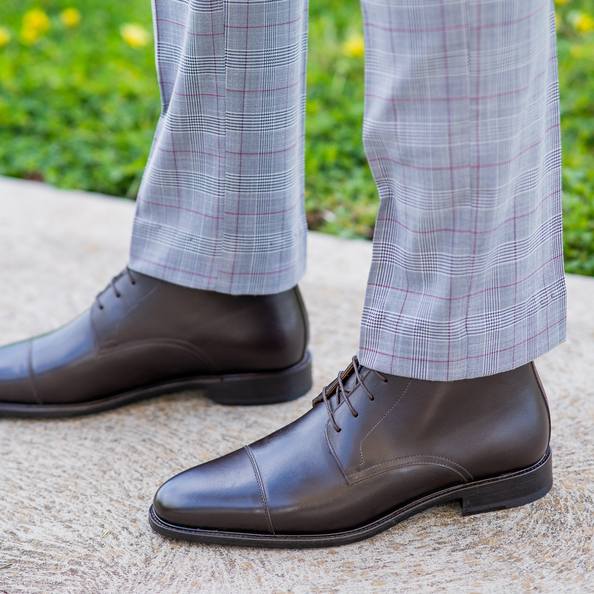 Men brown leather boots featuring box calfskin leather and blake rapid stitched construction paired with smart casual outfit