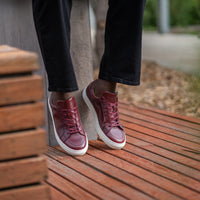 Men casual shoes sneakers featuring low top design and white rubber sole styled nicely with jeans