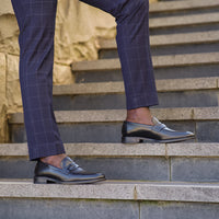 Mens black loafer paired with merino wool suit pant