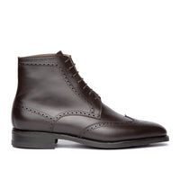 Mens brown wingtip boots featuring leather welt, traditional brogues and dainite rubber sole