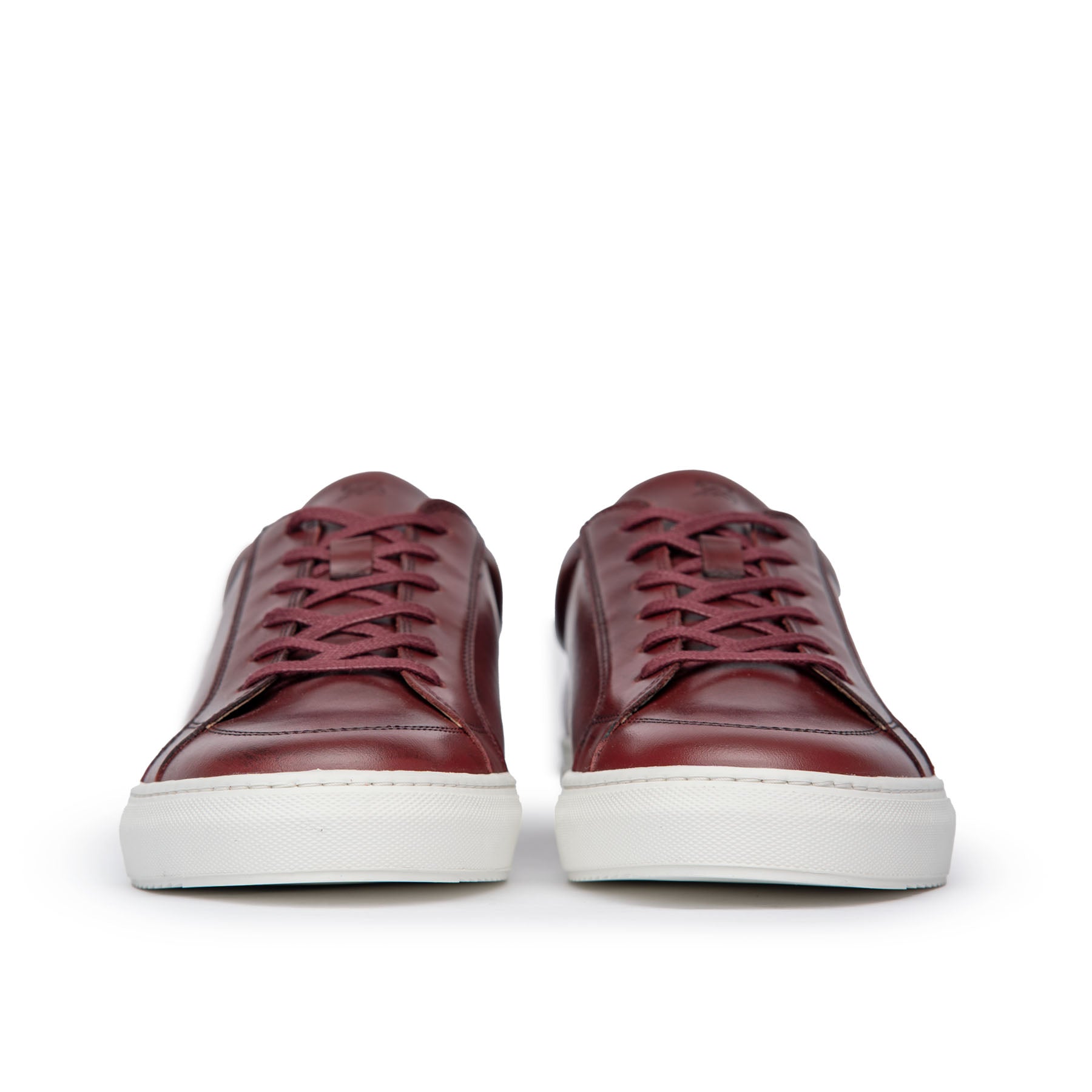 Mens casual low top sneakers expertly crafted using full grain leather in burgundy and rubber sole