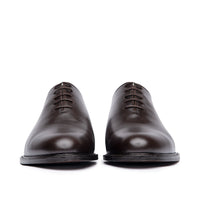 Men's leather dress shoes made from single piece of calfskin with beautiful patina at the top cap.