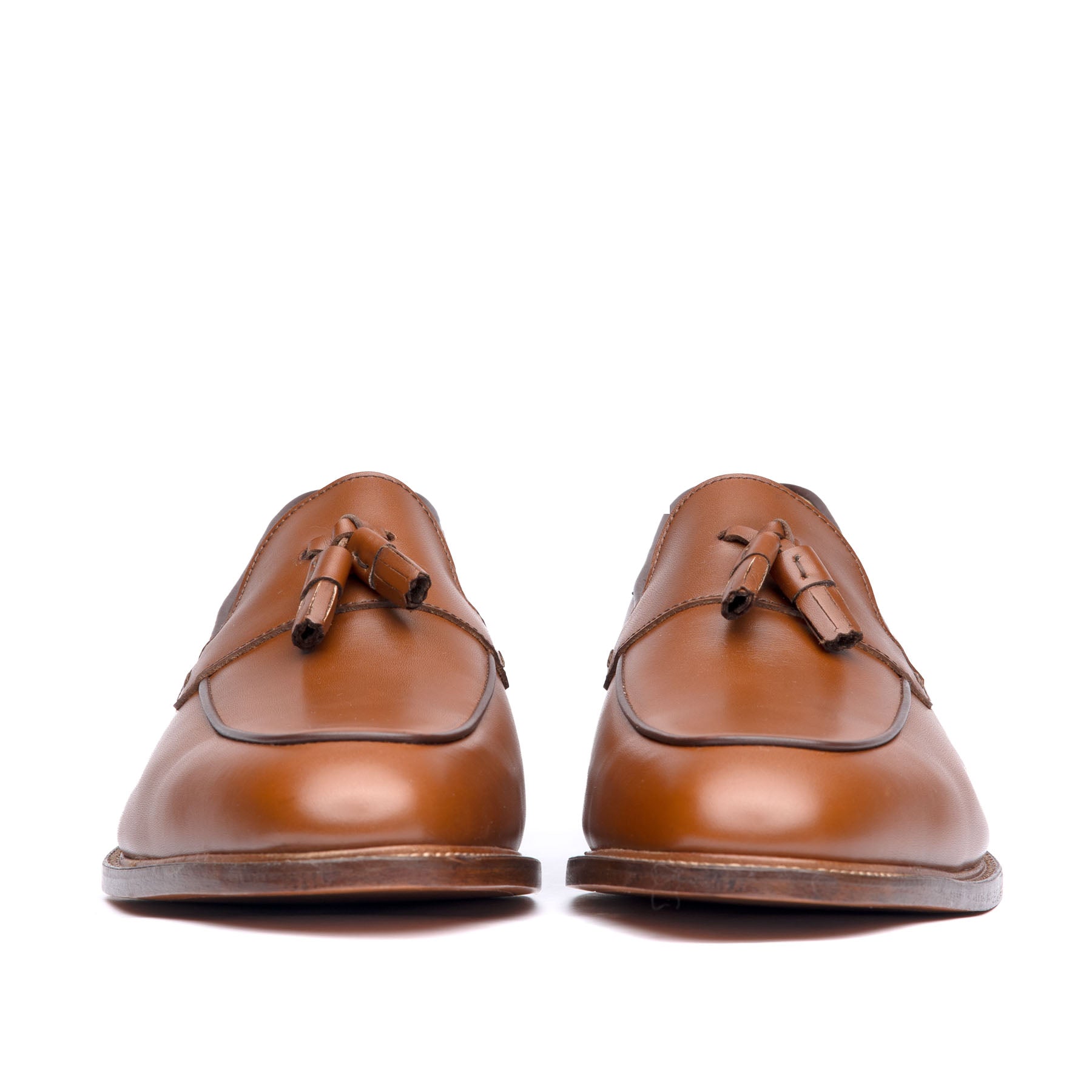 Tan tassel loafers made in Portugal with and almond toe