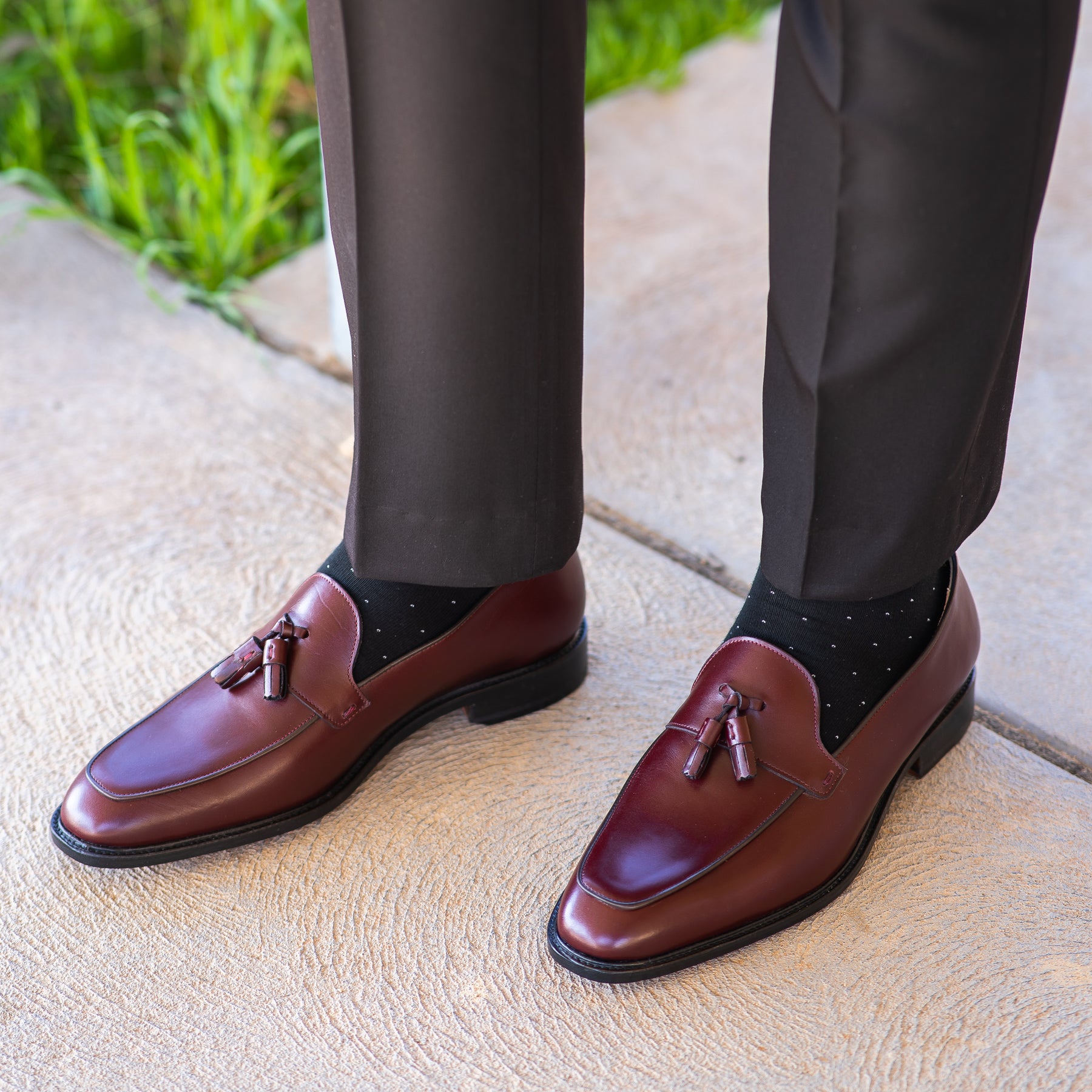 Burgundy tassel loafers, paired with black tailored dress pant and 100% cotton socks