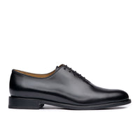 Oxford wholecut shoes in black leather, handcrafted from a single piece of natural full grain calfskin.