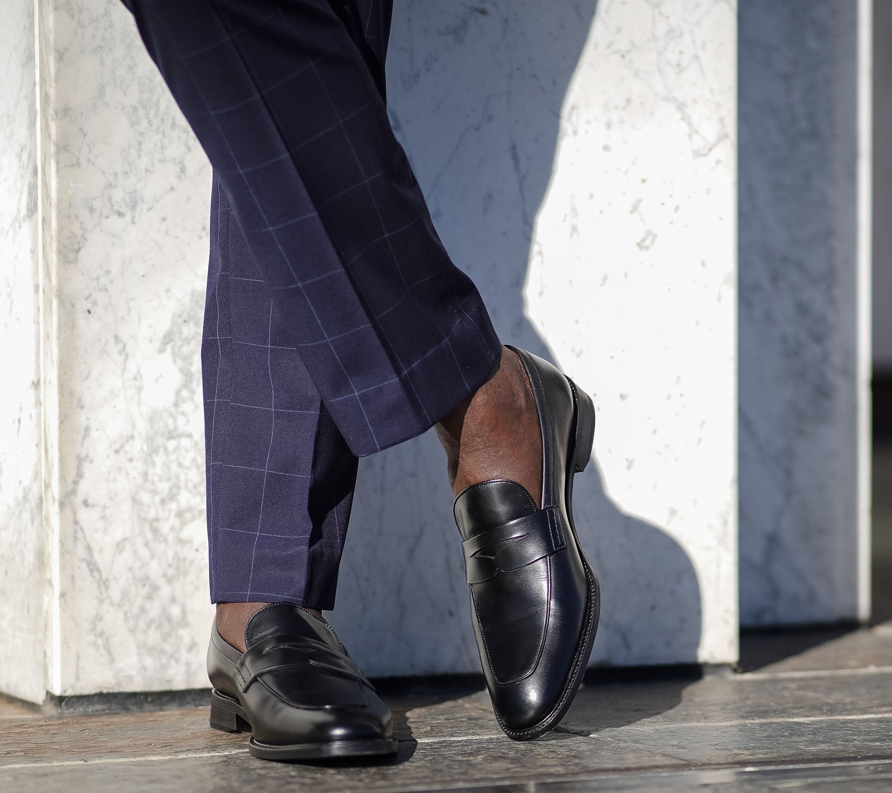 Mens penny loafer made in Portugal and paired with dress pant with no socks