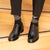 Black mens dress shoes paired with slim fit suit with matching patterns socks
