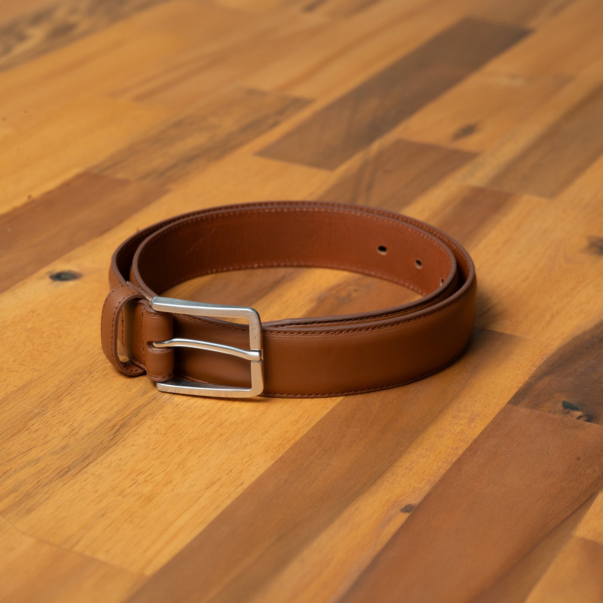 Premium men's tan leather belt. Crafted for durability and style. Wear with your favourite jeans.