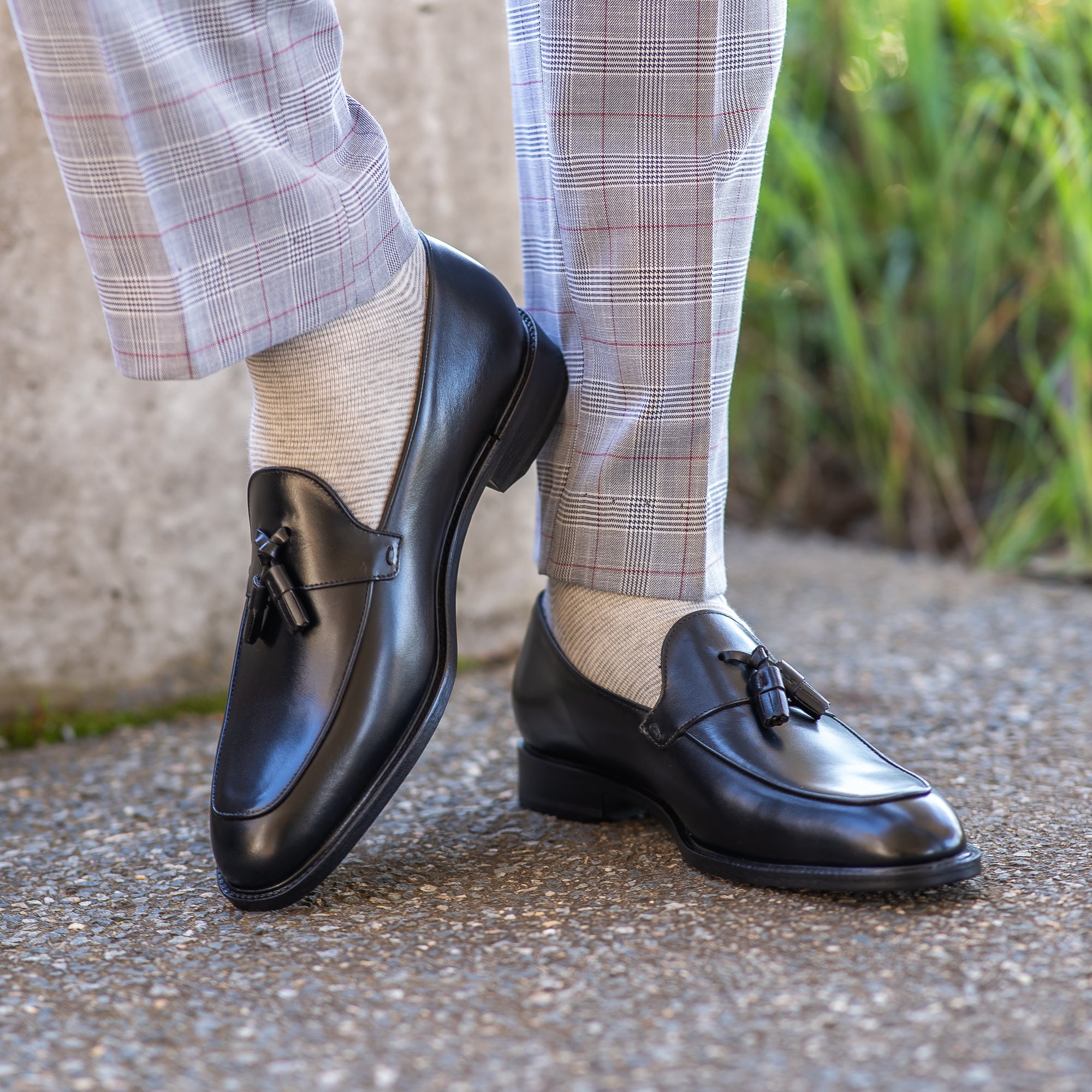 Leather loafers with tassels paired nicely with tailored suit and 100% cotton socks for professional look