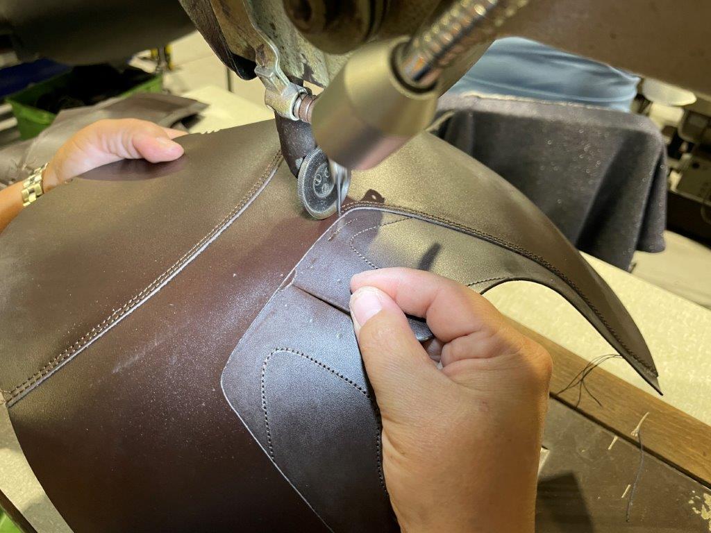 Sewing upper of men's dress shoes using full grain leather