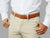 Men’s tan belt with decorative detailing, crafted in Spain. For refined dressing.
