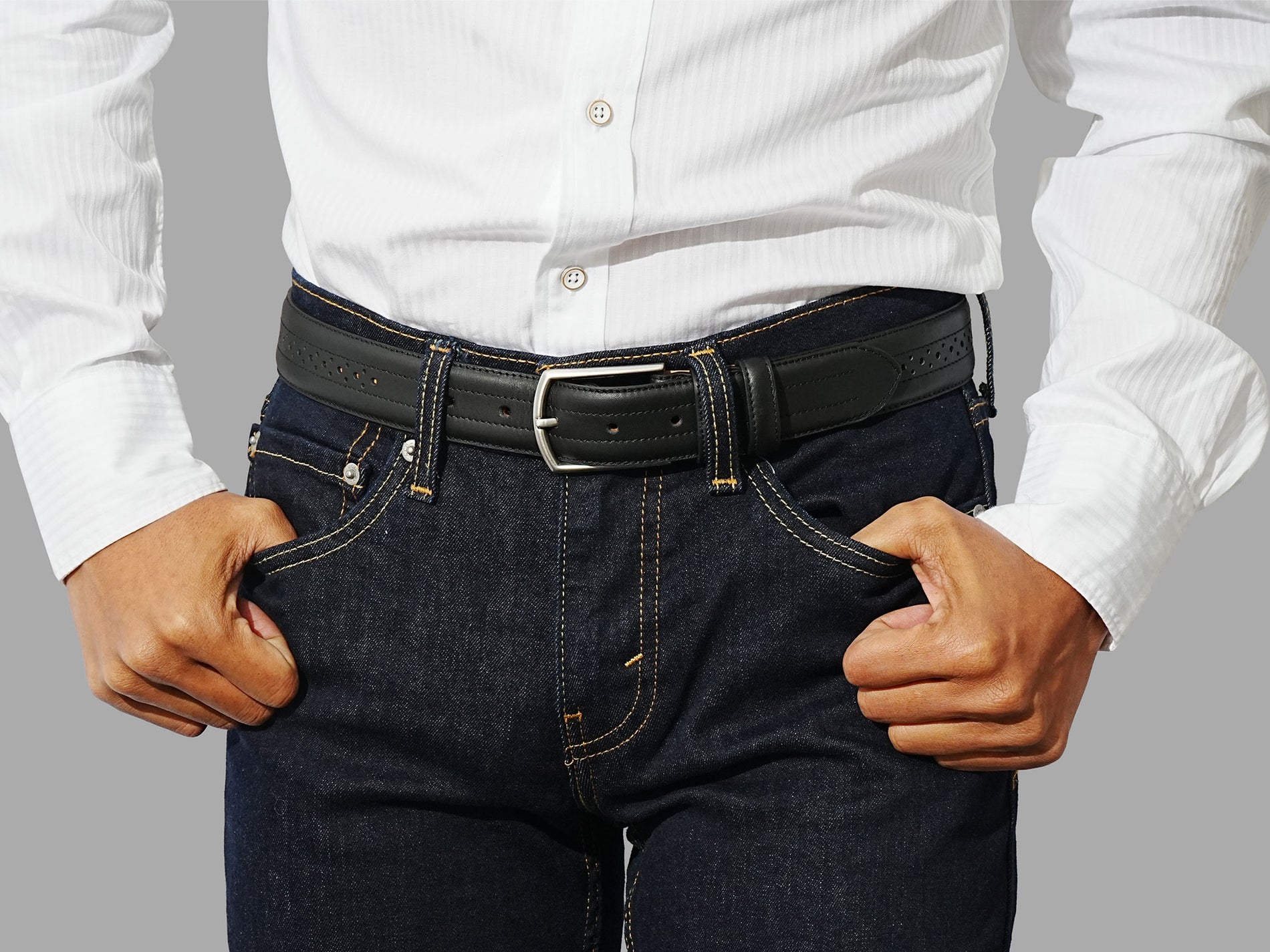 Mens black leather belt. Brogue detailing for a refined look. A great partner for your dress boots.