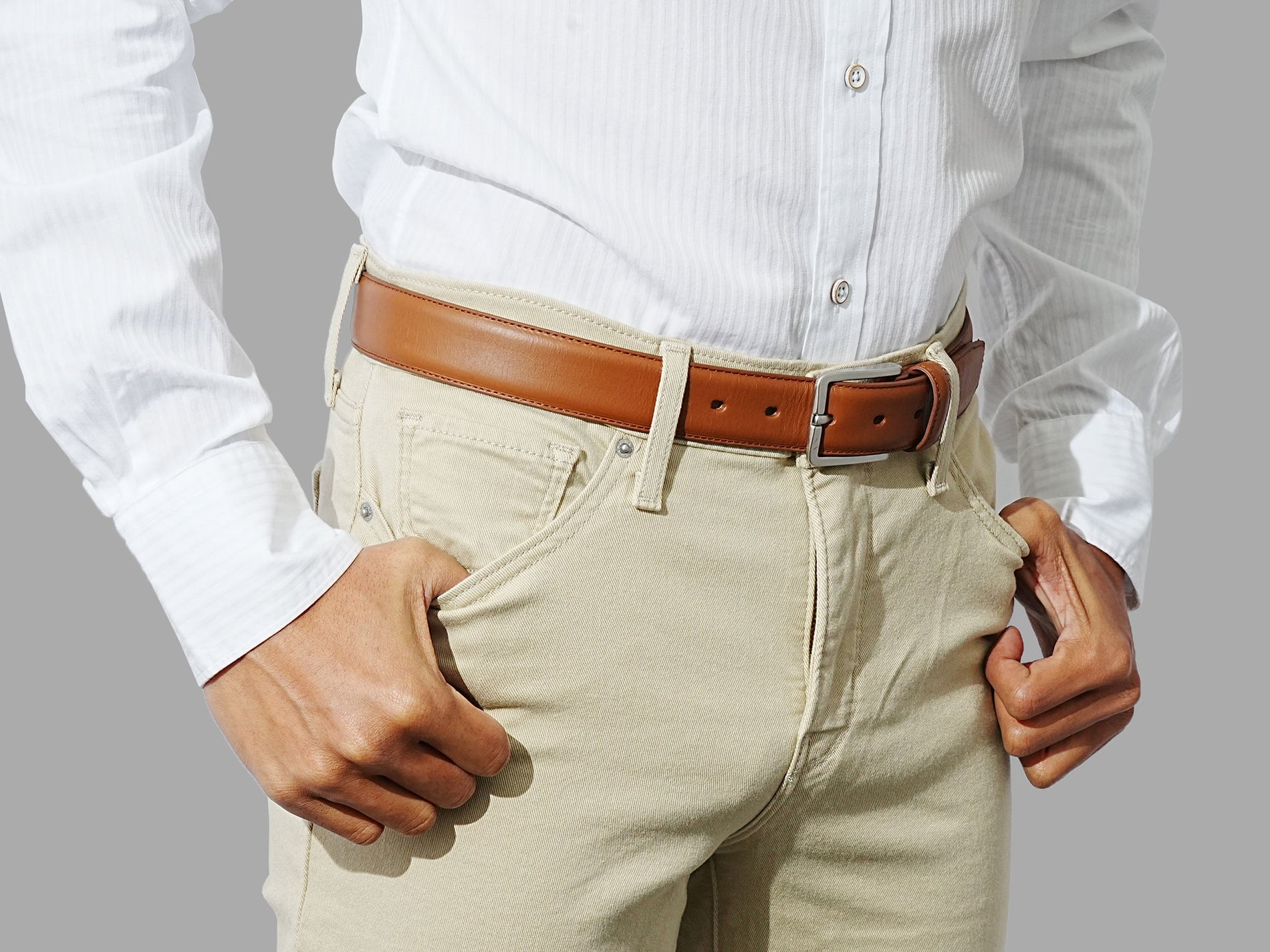 Premium tan leather belt for men. A must-have accessory for jeans, chinos or dress pants.