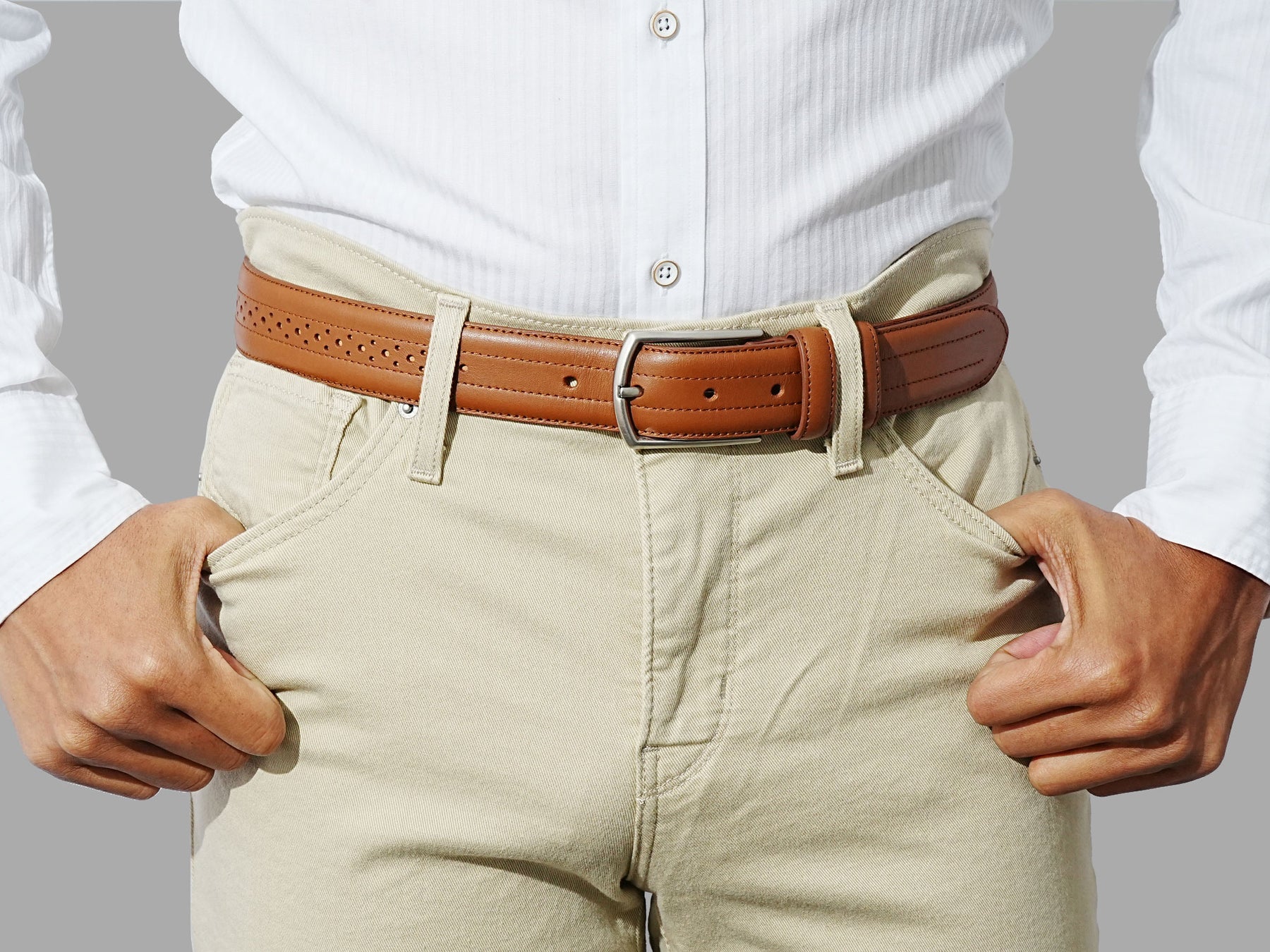 Leather belt for men with brogue accents. Wear it with suits or weekend 
