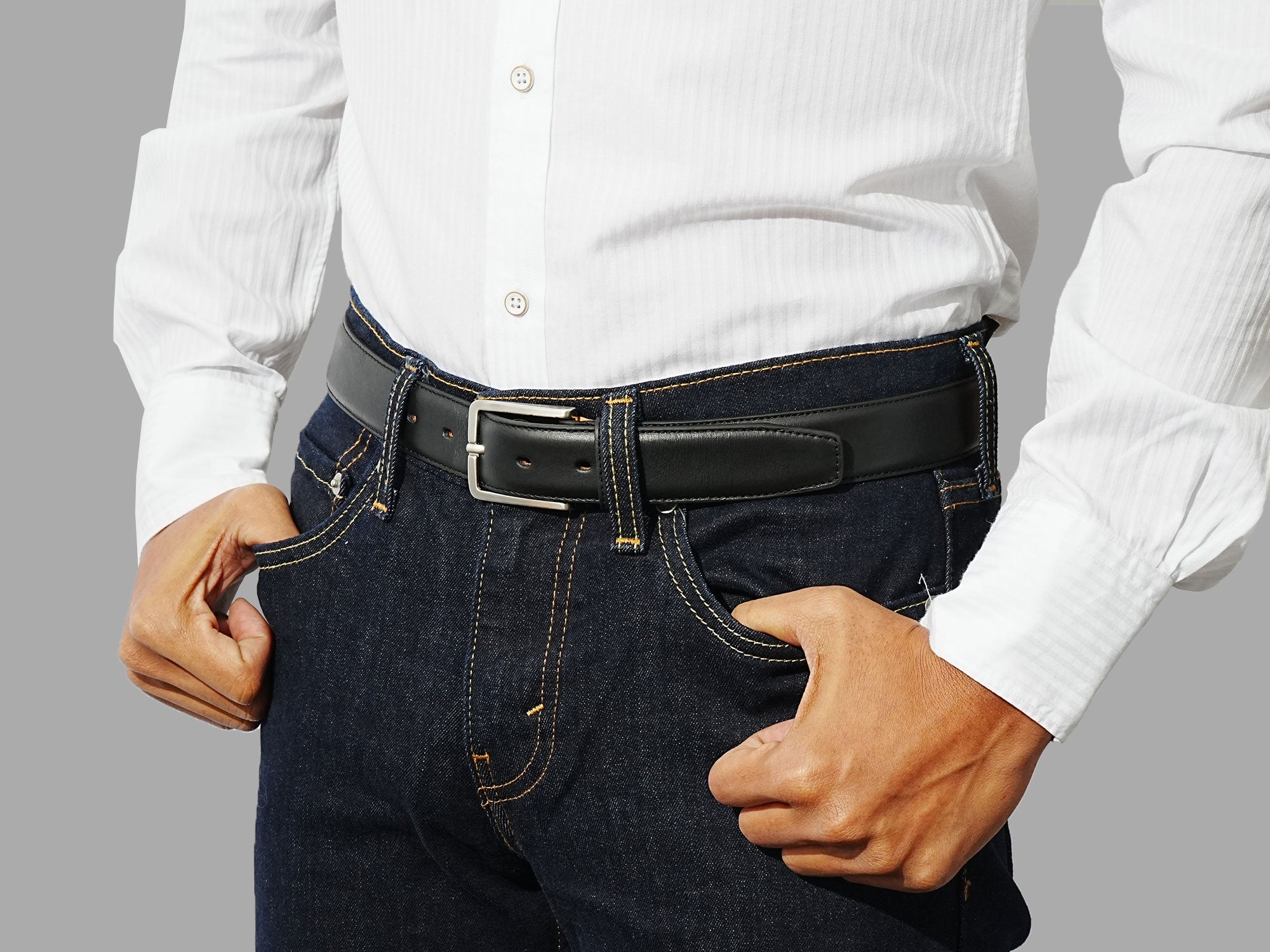 Classic men’s black belt. Pair with tailored trousers, smart shirts, and office outfits.