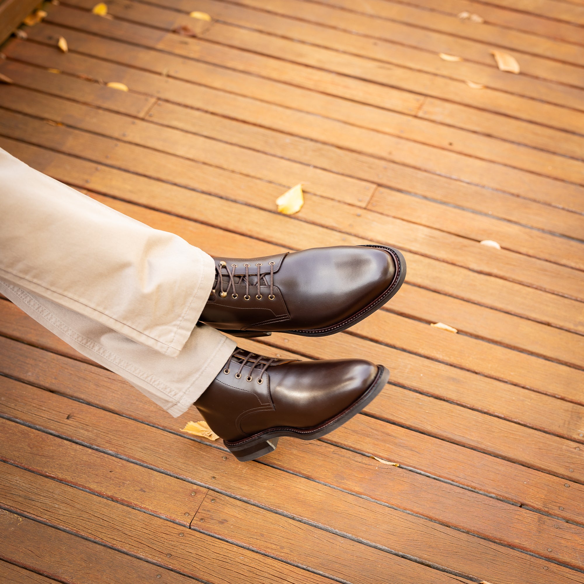 Men's brown leather dress boots with rubber sole paired with smart casual outfit for all seasons