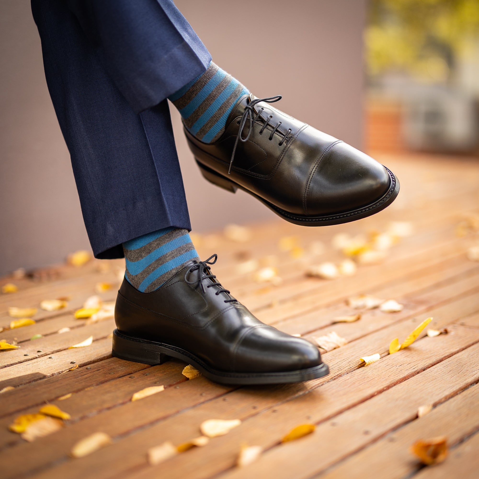 Black oxford dress shoes are closed laced with cap toe suitable for weddings and official events