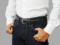 Mens full grain leather dress belt in black calf paired with tailored trousers, smart shirts, and office outfits.