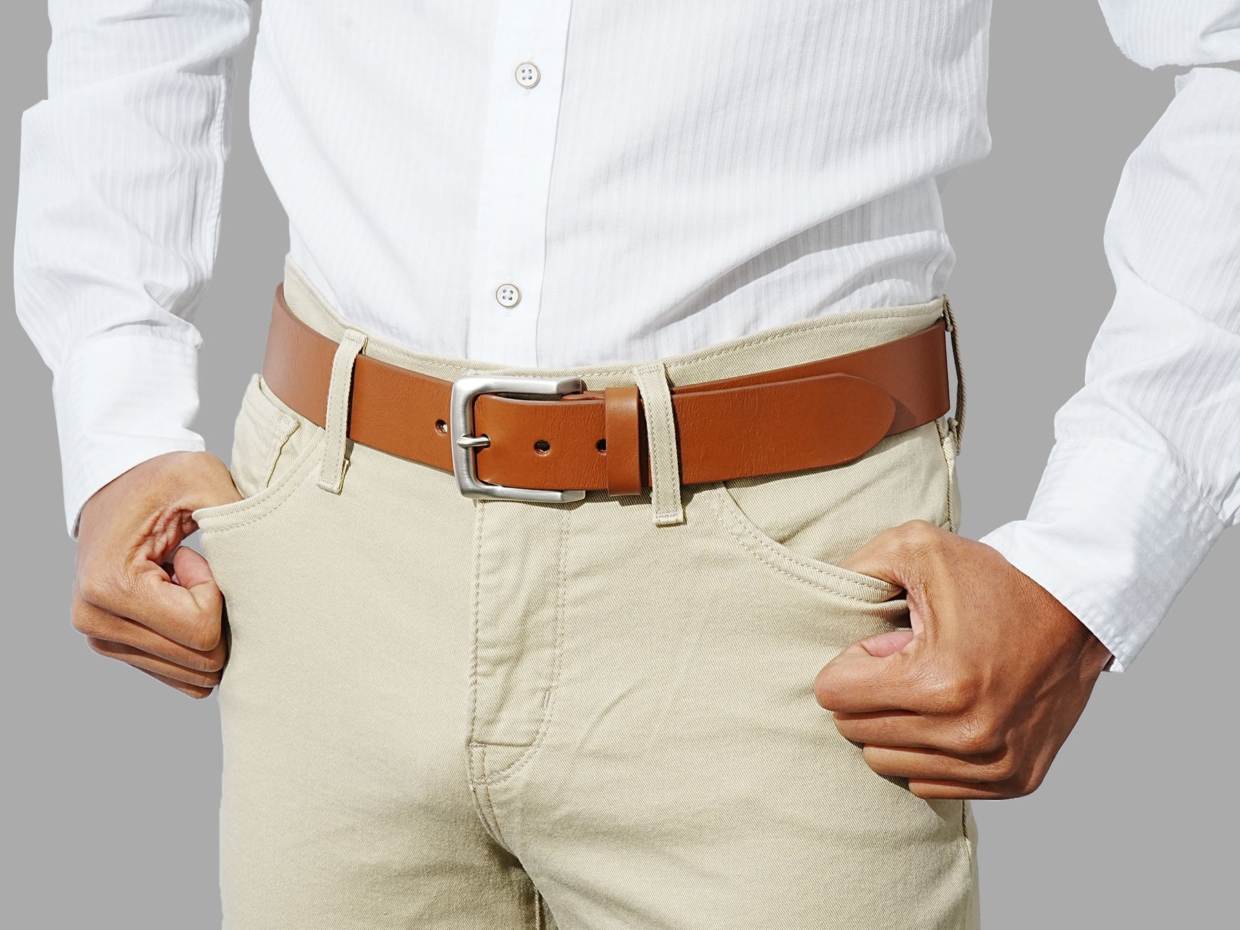 Men’s tan leather jeans belt with polished buckle. Perfect fit for denim and casual wear.