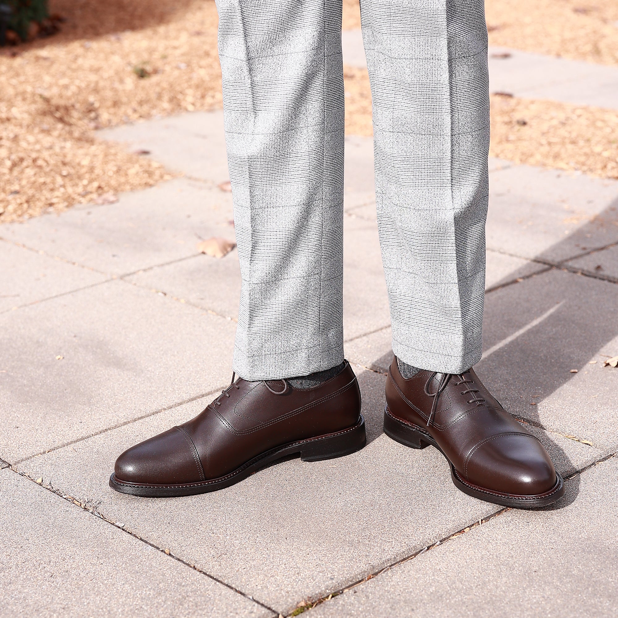 Mens brown formal shoes are closed laced with cap toe suitable for weddings and business wear