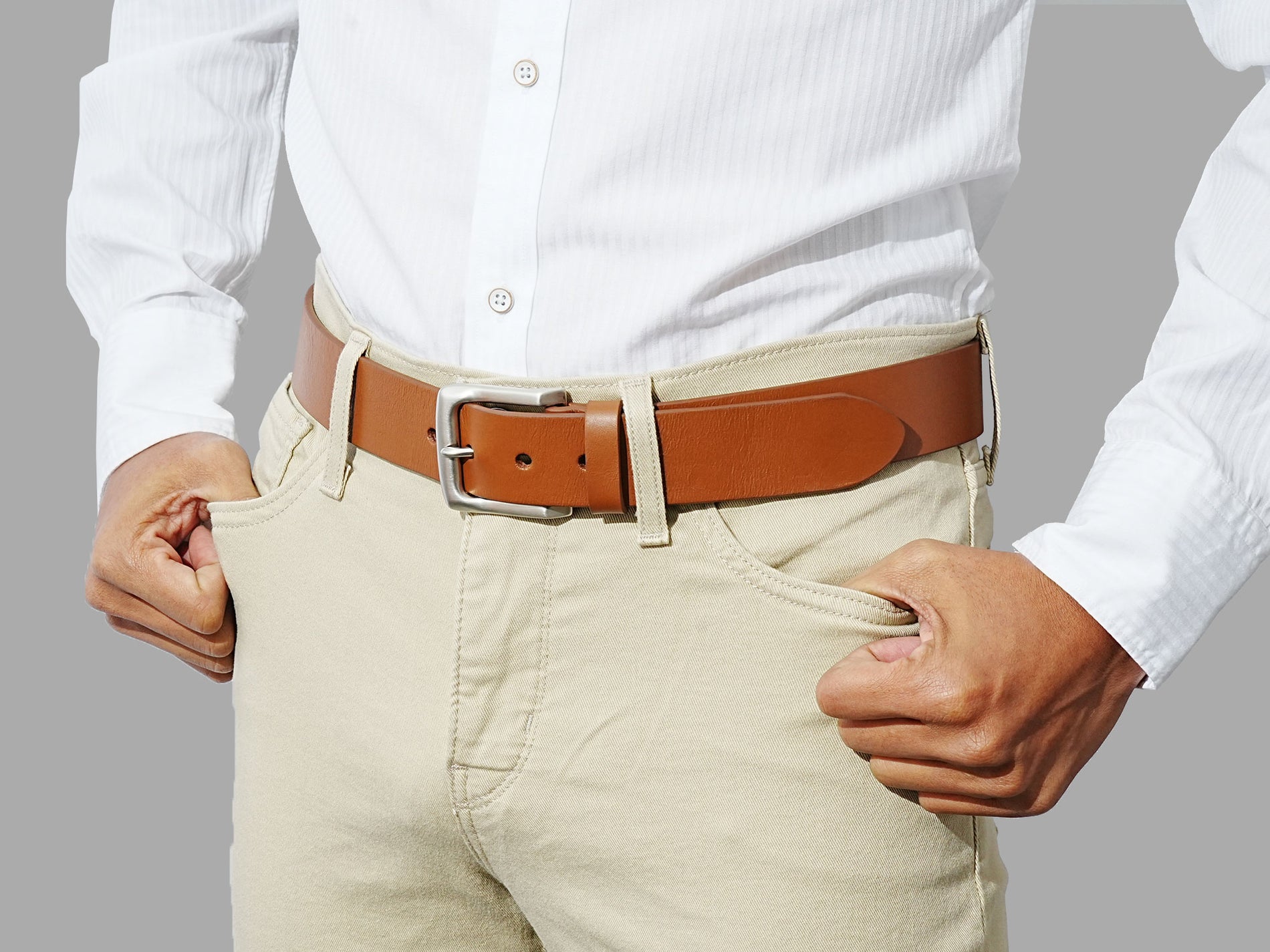 Men’s tan leather belt. The essential accessory to wear with casual trousers or denim.