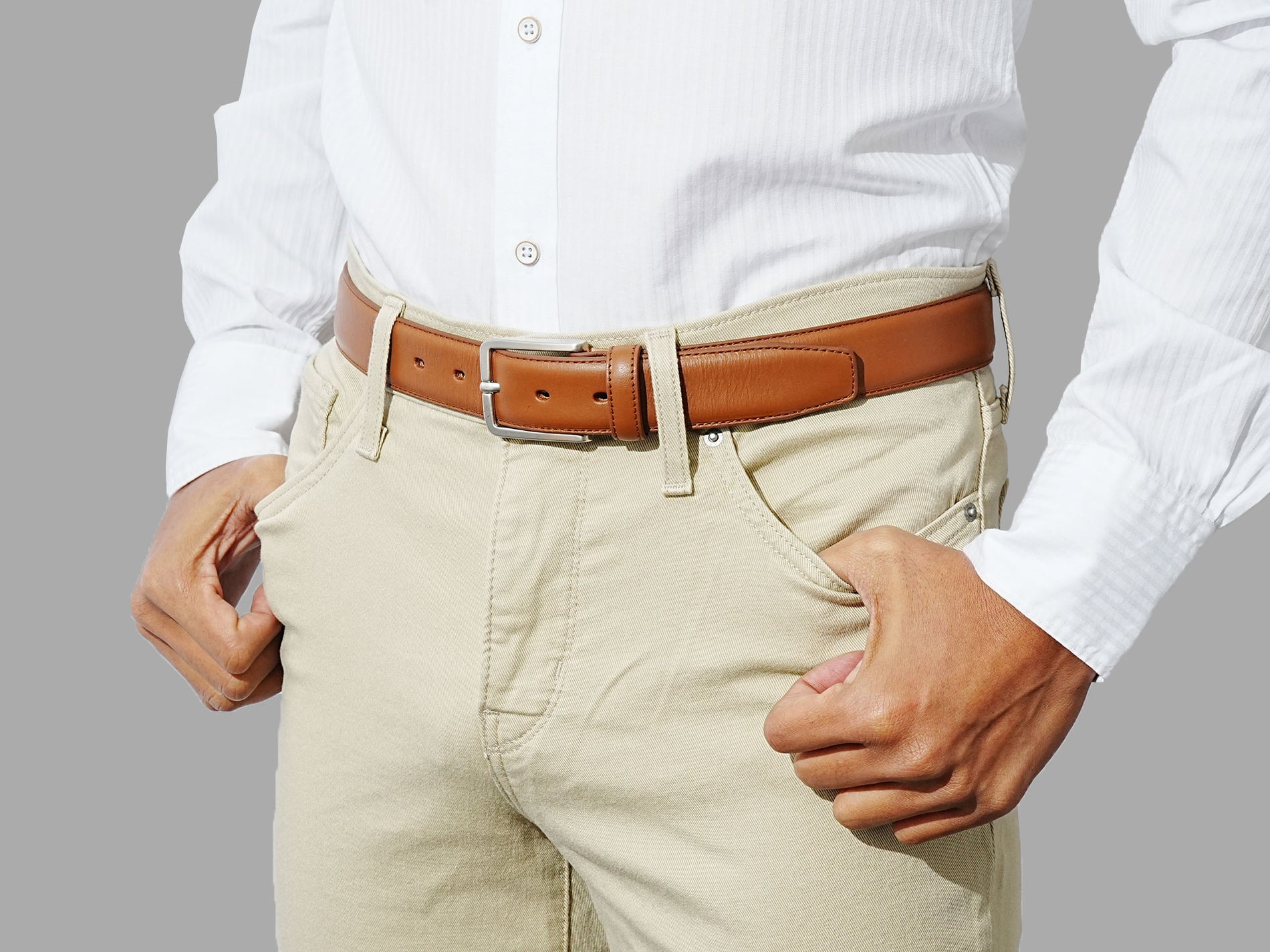 Tan leather belt for men. Artisanal quality and durability. Wear with chinos and a blazer.