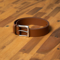 Tan leather belt for men with buckle. Sharp finish to pair with chinos or casual pants.
