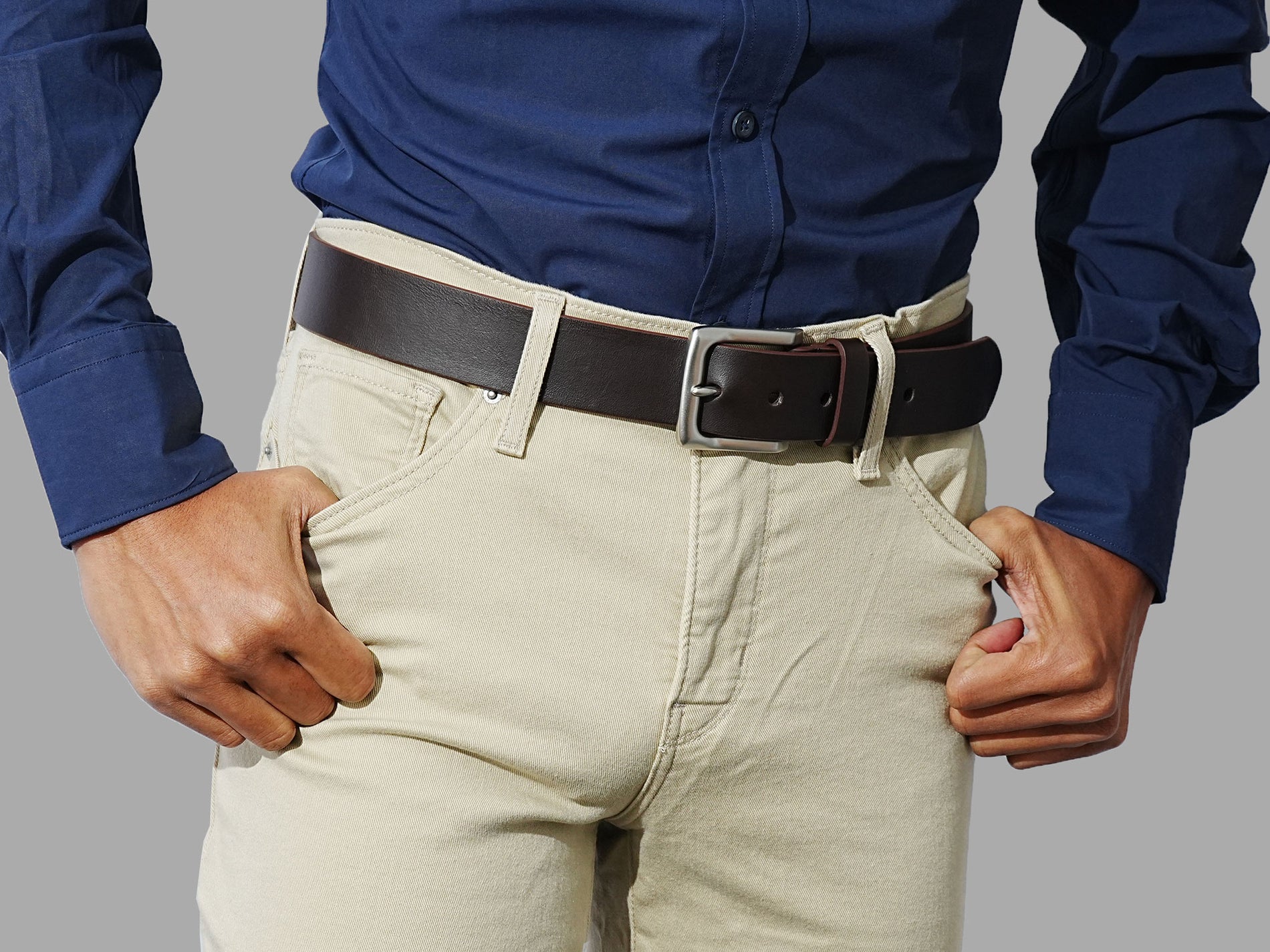 Men’s brown leather belts with solid buckles. Wear with denim, chinos, or smart casual.