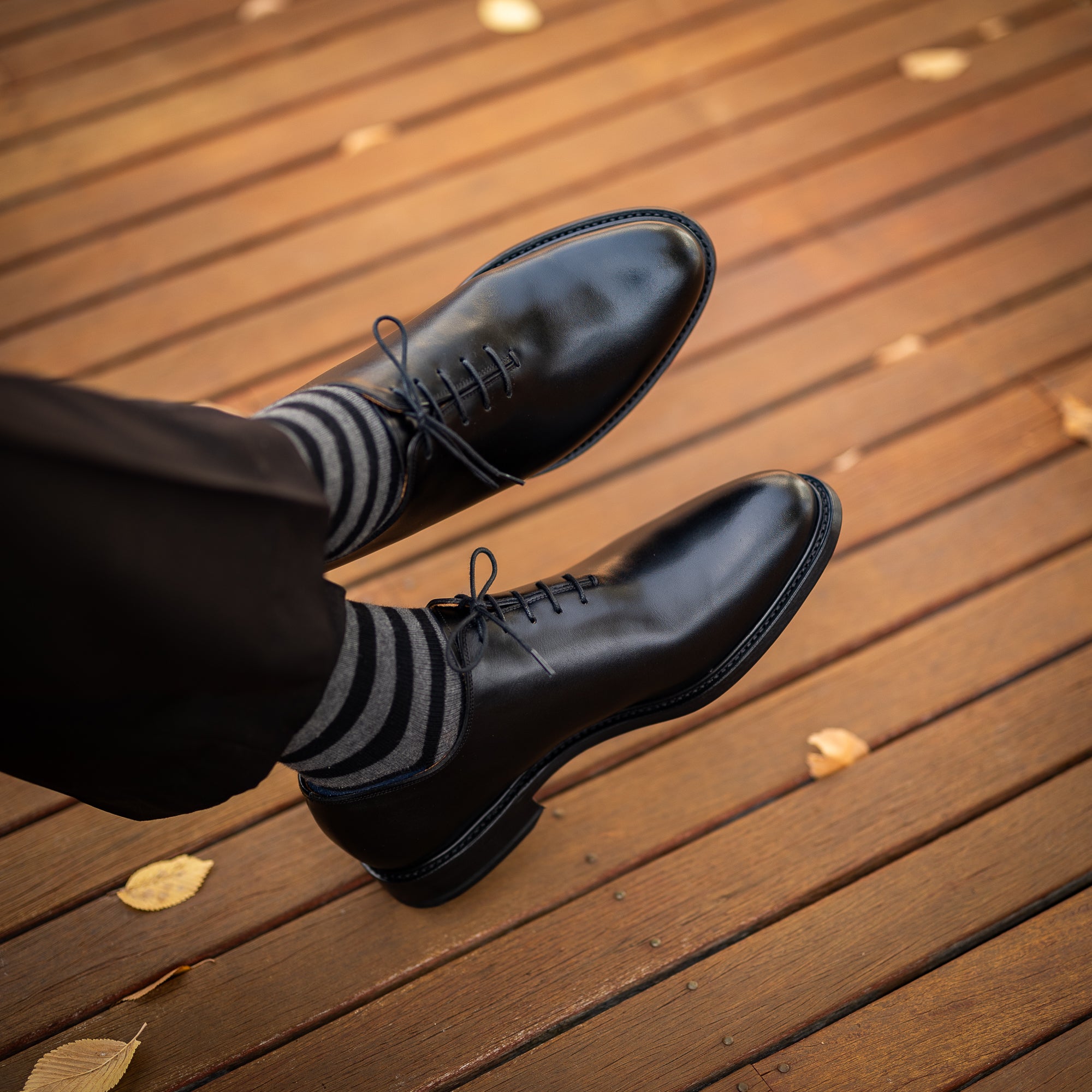 Wholecut oxford shoes paired with tailored suits and slim fit dress pants for a polished professional look