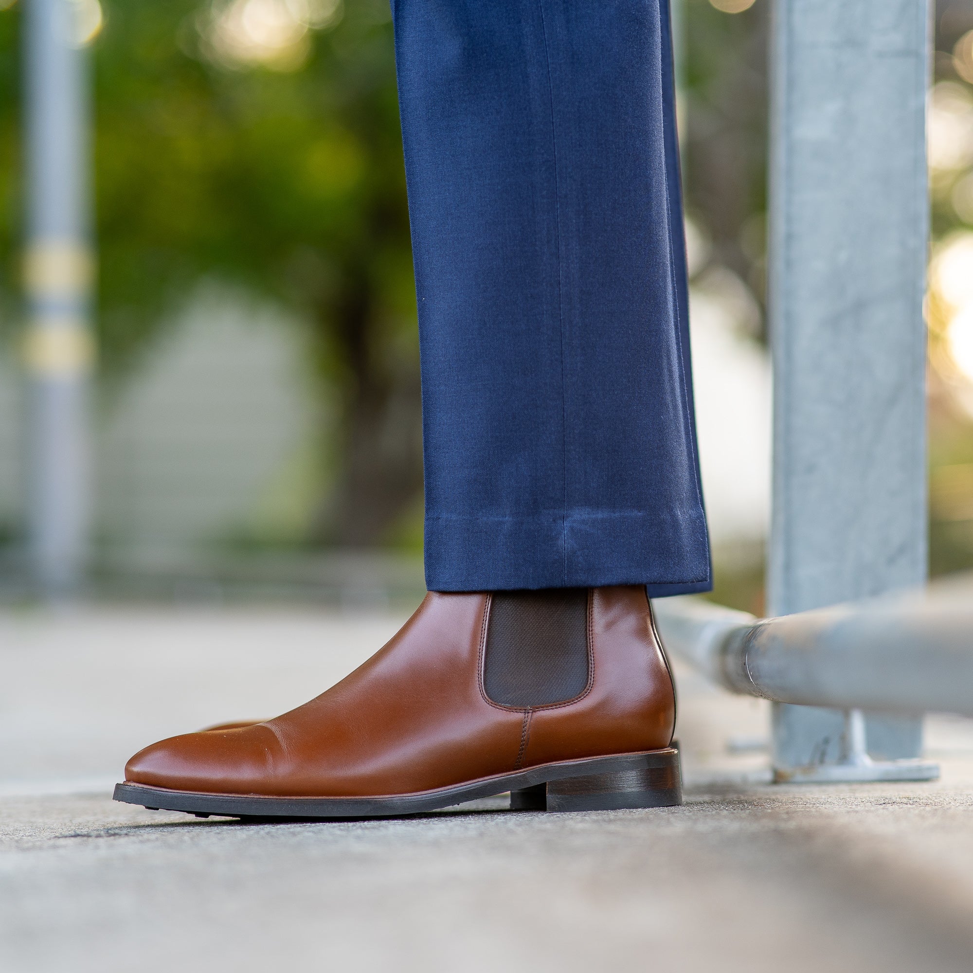 The Safari mens chelsea boots in tan paired with tailored blue merino wool dress pants