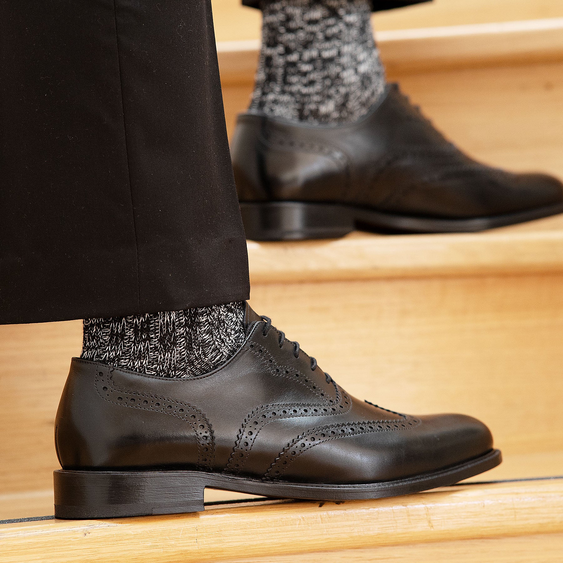 Mens oxford wingtip shoes with brogues styled with 100% wool black dress pant