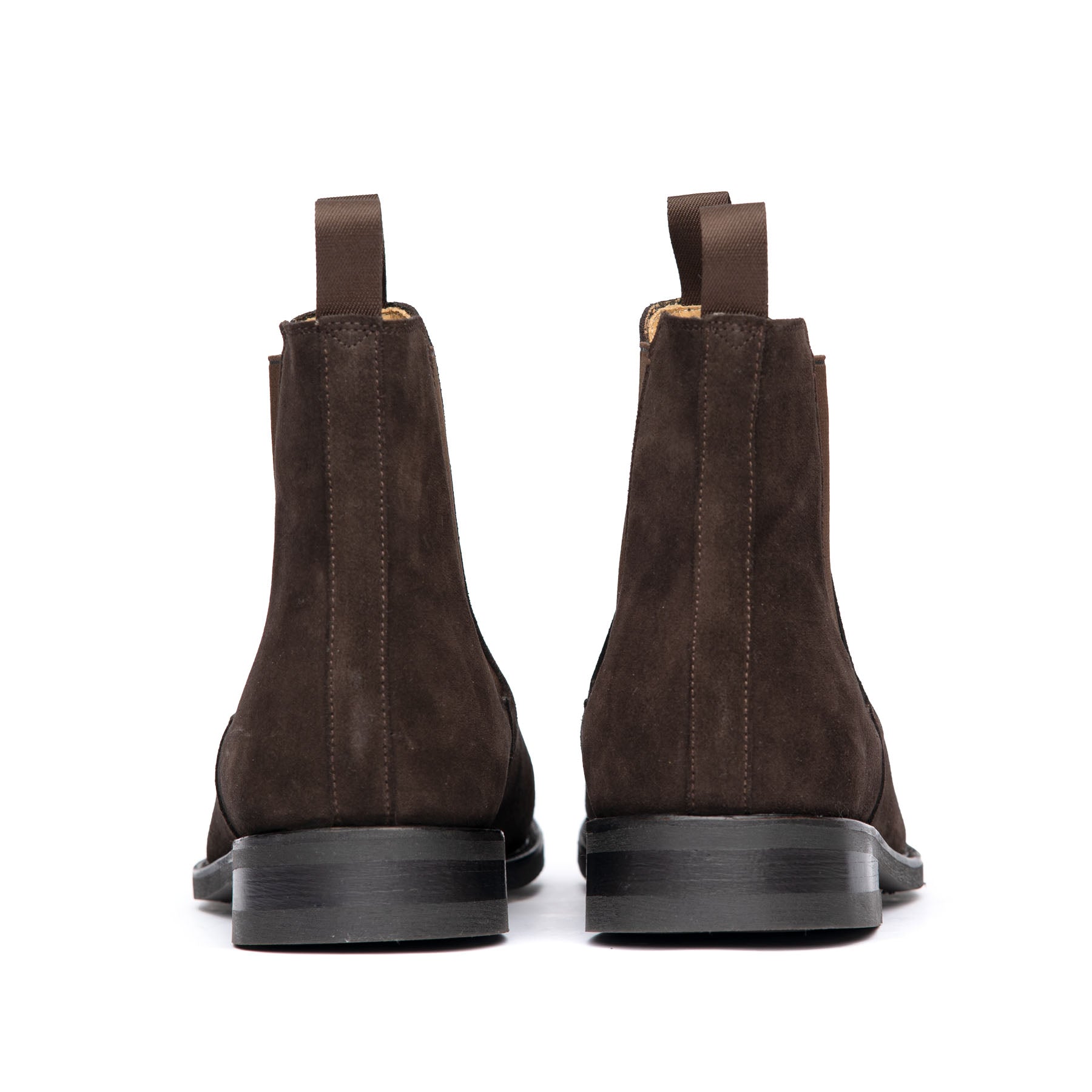 The Safari dress laceless boot in suede, packed with natural cork, steel shank at the midsole and leather heels 