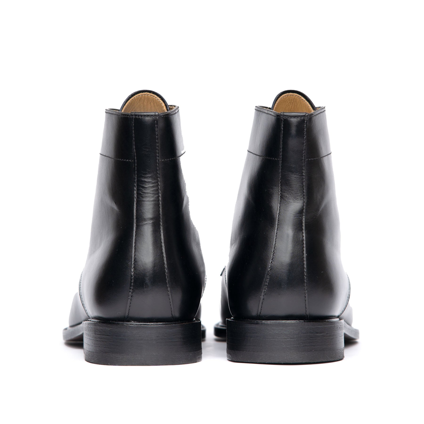 The Sahara cap toe lace up boot in black with leather heels and rubber pad