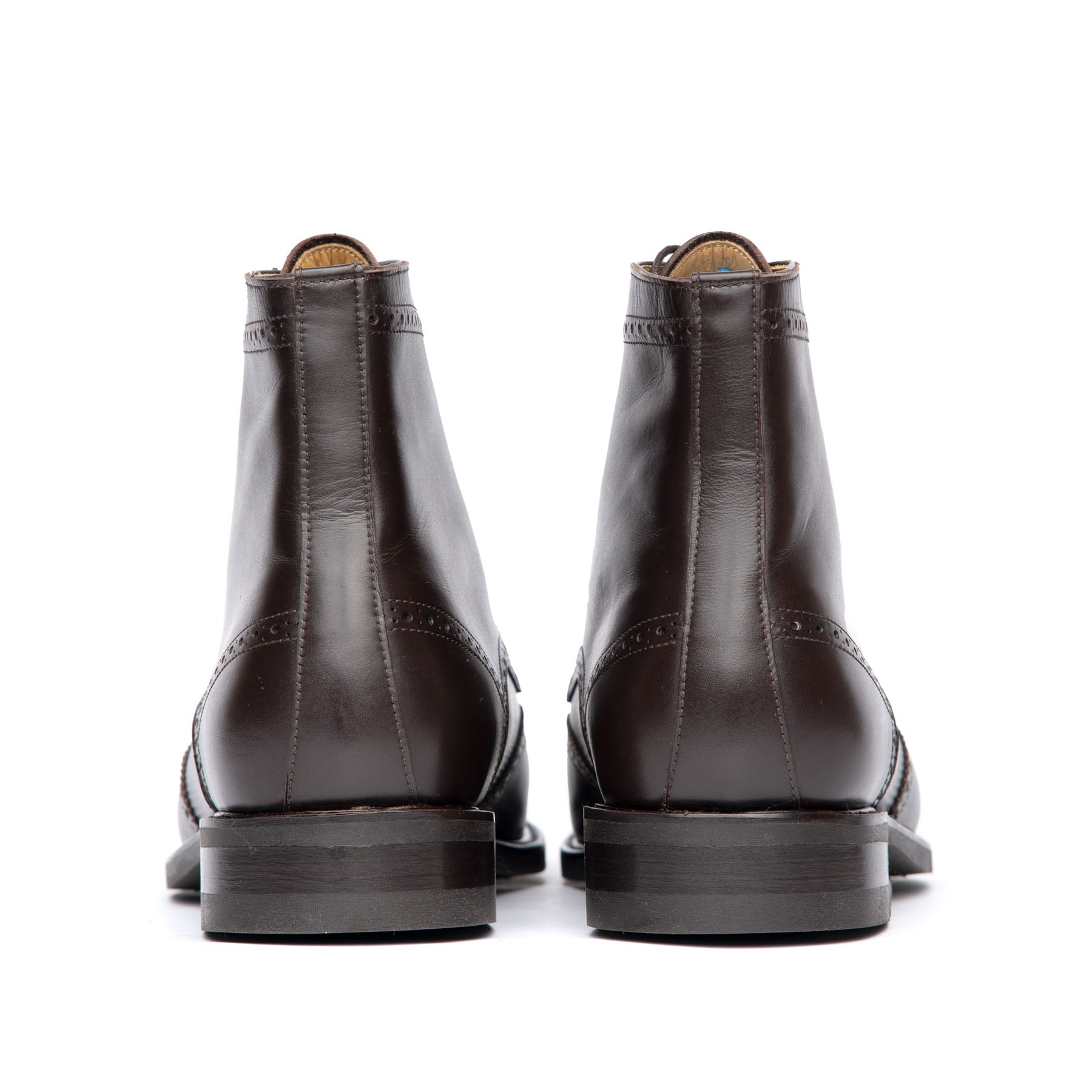 The Outback ankle leather boot in dark brown, with a combination of leather heels and studded rubber pad.