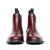 Sleek and all-purpose leather Chelsea boot in burgundy with beautiful patina at the toe cap from Sparrods & Co