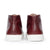 Fashionable hi-top boot for men in red, minimalist design and clean lines.