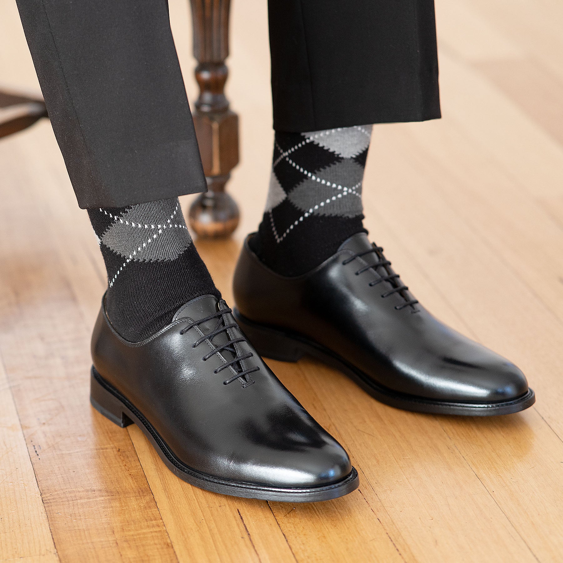 The Kingston oxford wholecut leather shoe paired with 100% wool dress pant and stripped cotton socks